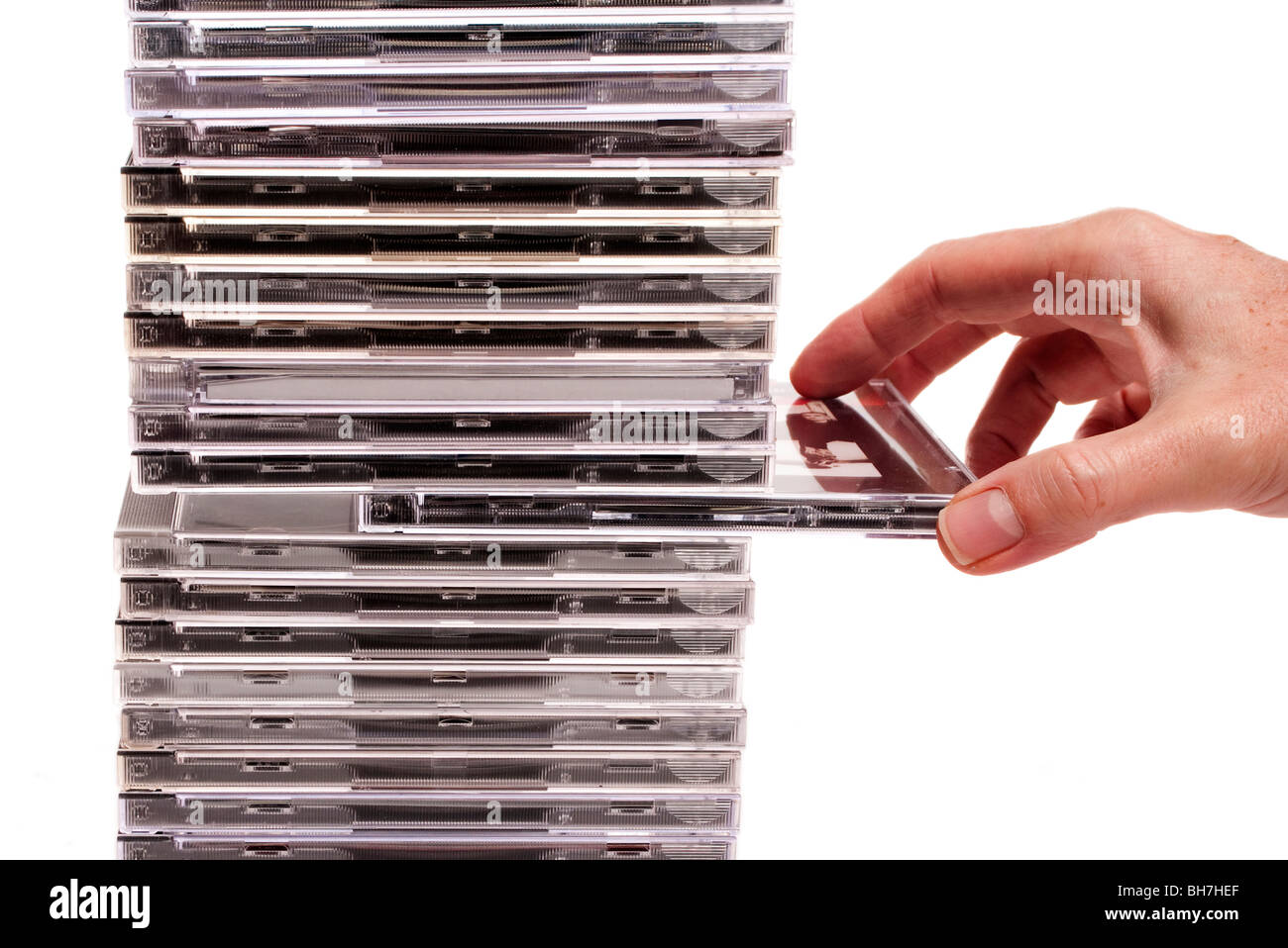 taking cd case from tower Stock Photo