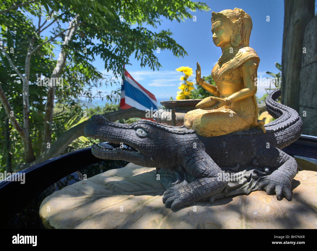 Gold figure riding a crocodile, Big Buddha, Phuket, Thailand Stock Photo