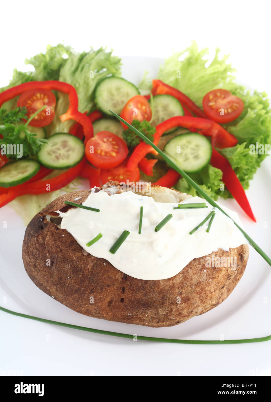 A baked Russet potato topped with a cottage cheese and chives mixture