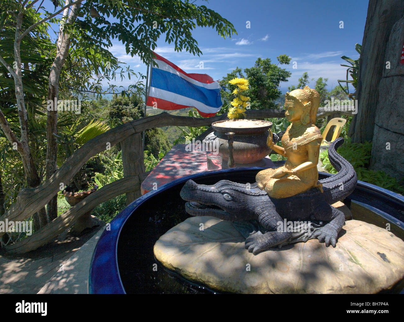 Gold figure riding a crocodile, Big Buddha, Phuket, Thailand Stock Photo