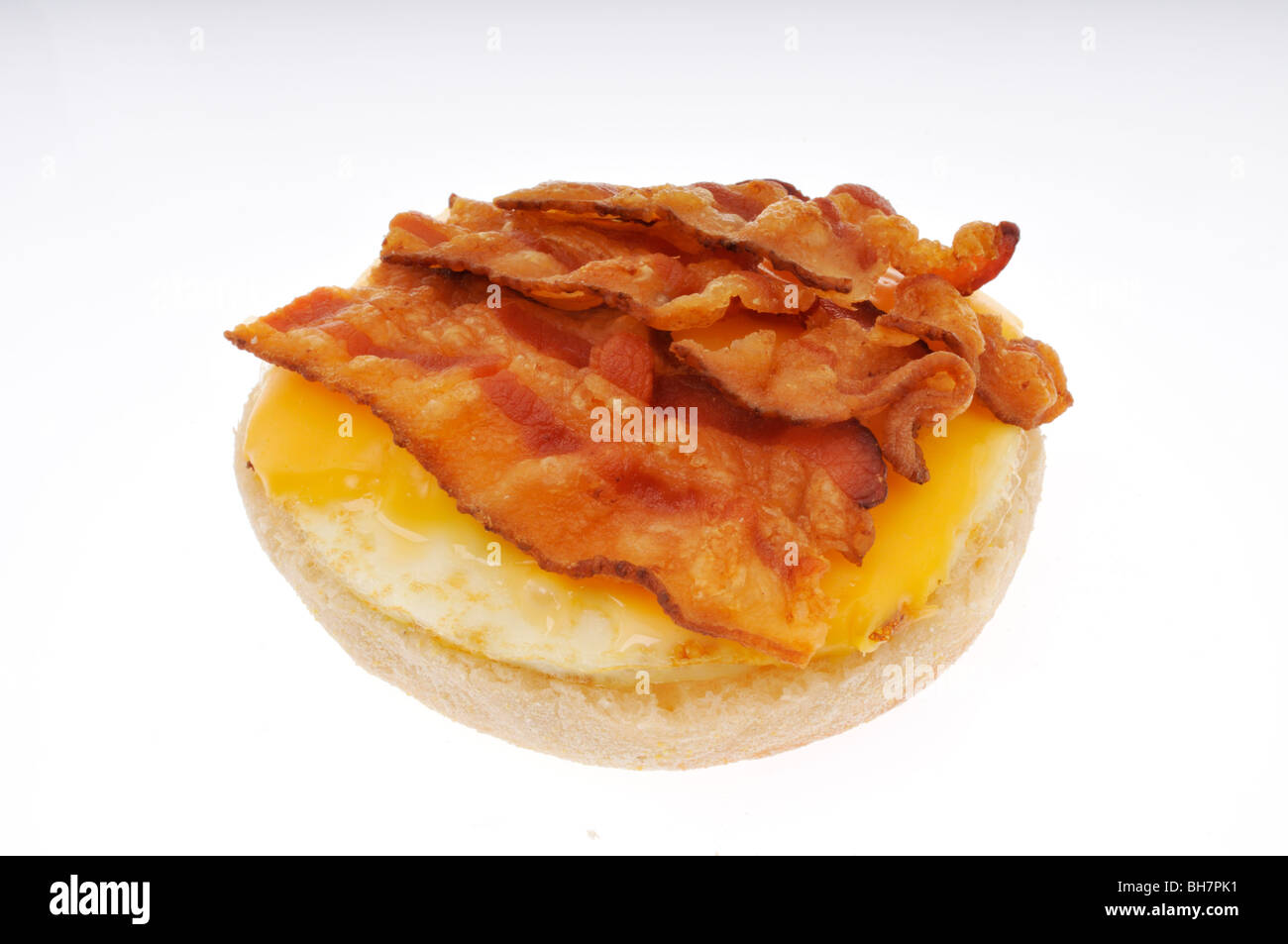 Open bacon, fried egg and cheese on english muffin breakfast sandwich