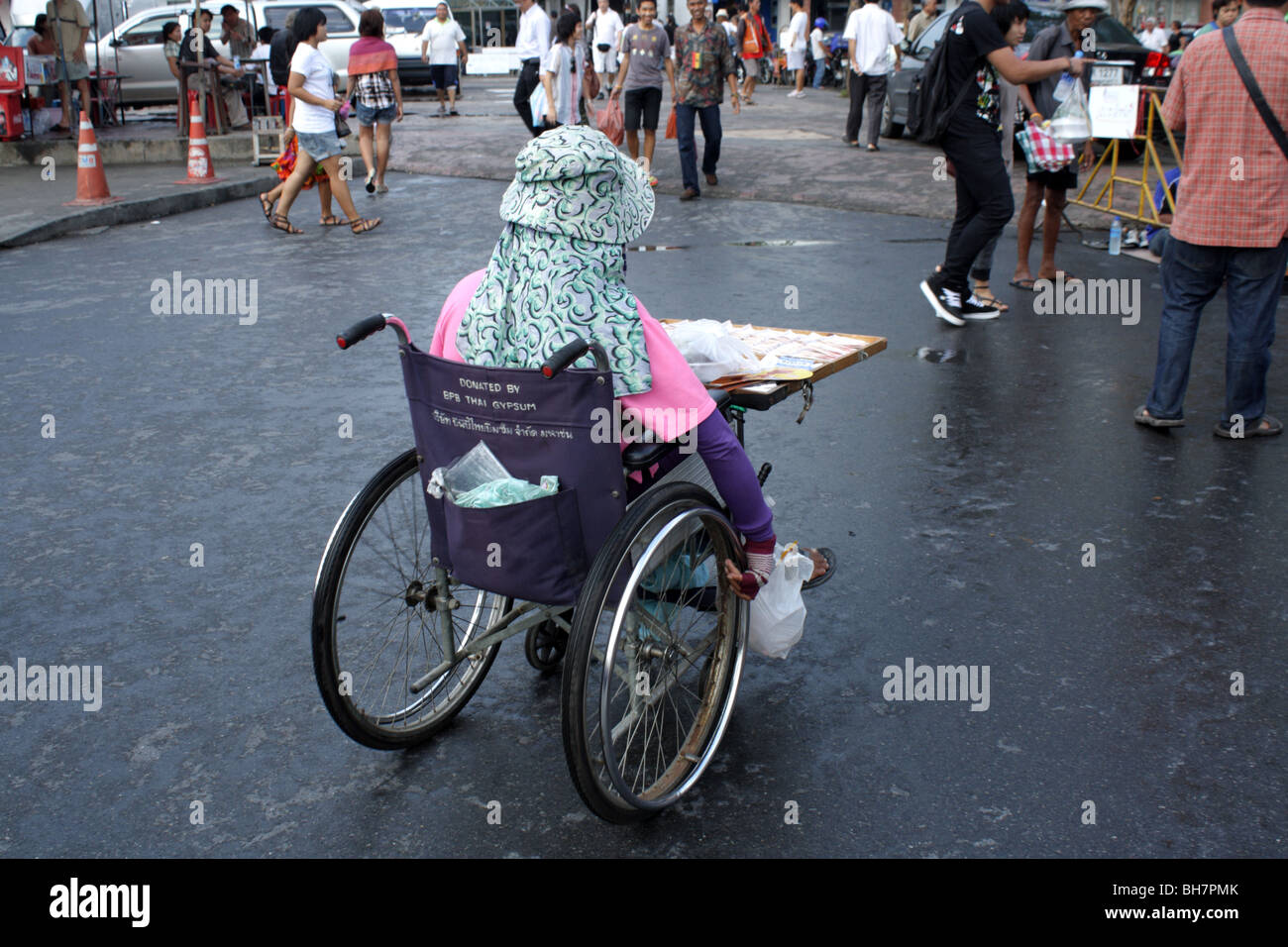 Cripple at Chatuchak Weekend Market , Bangkok , Thailand Stock Photo