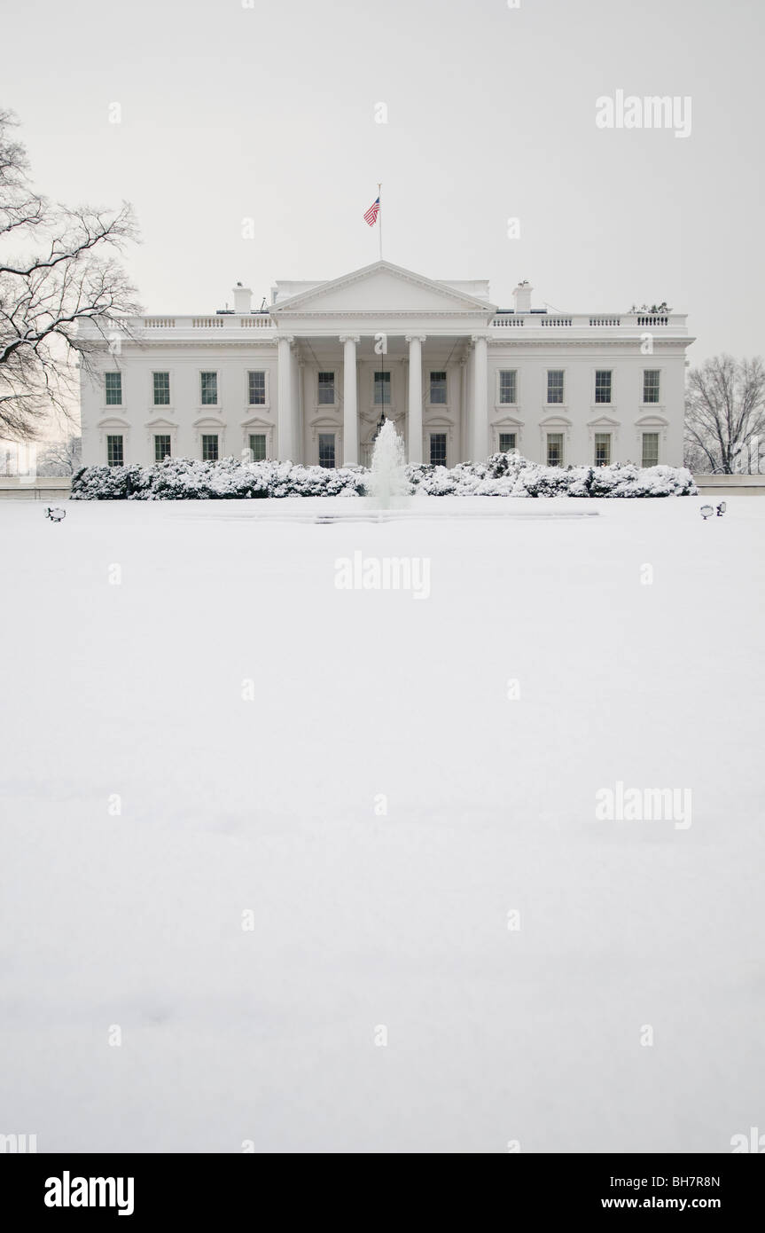 WASHINGTON DC, USA - The White House in Washington DC after a recent heavy snowfall that blanketed the grounds and trees. Stock Photo