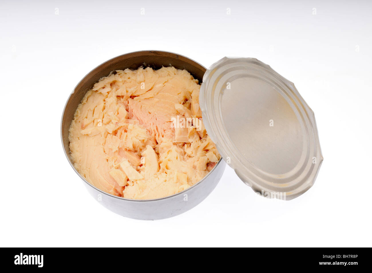 Open can of albacore white tuna fish in water with tin top on white background cut out. Stock Photo