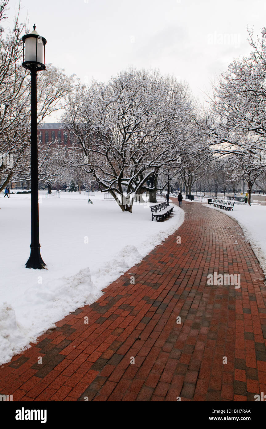 WASHINGTON DC, USA - A red brick pathway in Lafayette Park opposite the White House is cleared after a recent snowfall that blanketted the entire region. Stock Photo