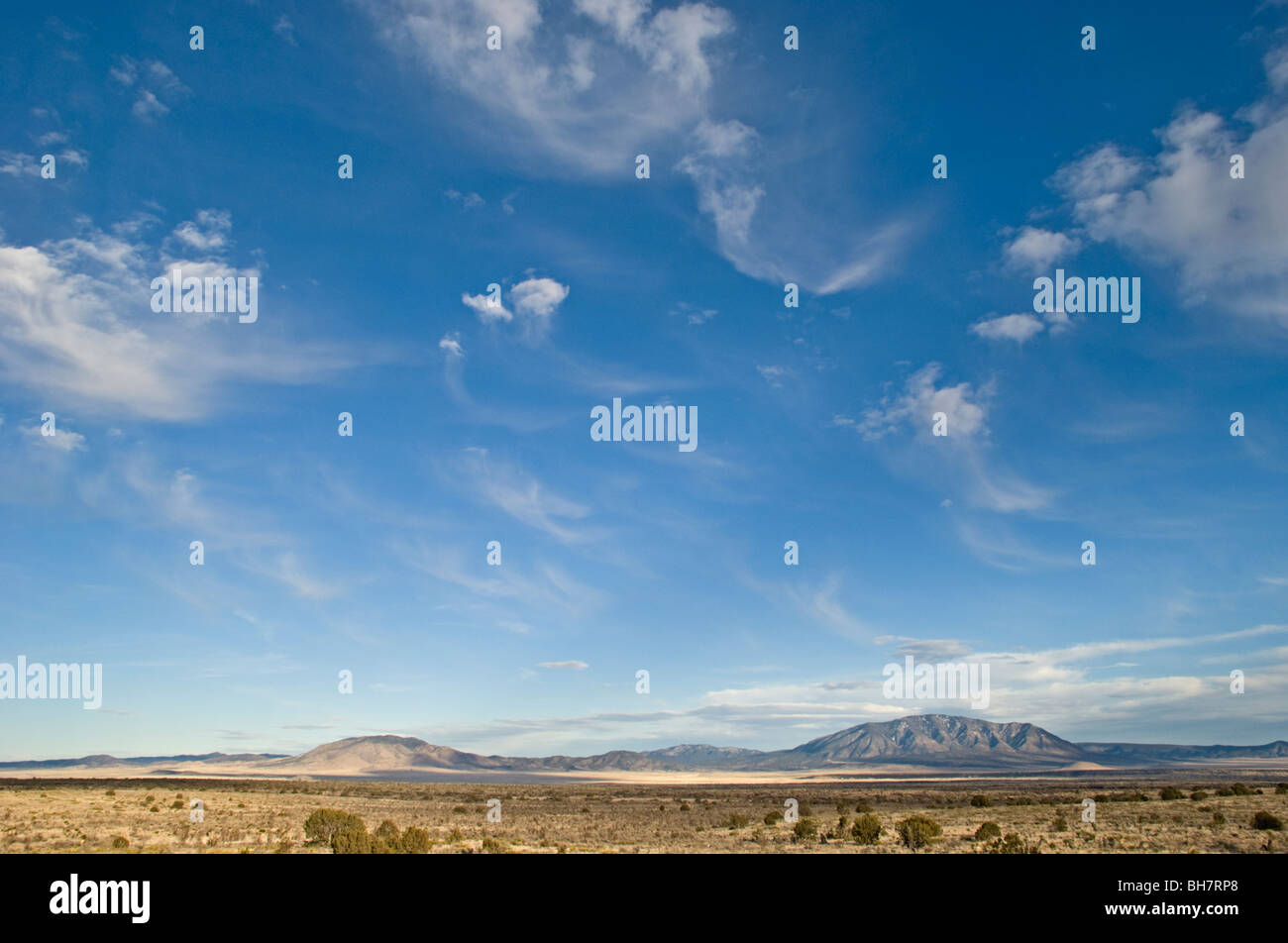 Light fluffy clouds decorate the southwestern sky near Carrizozo, New