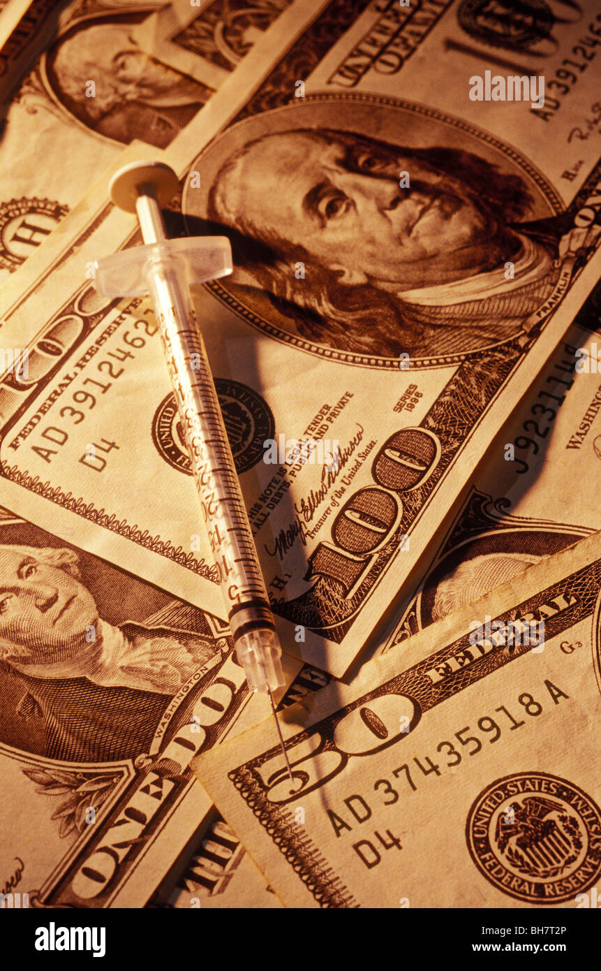 syringe on American money Stock Photo