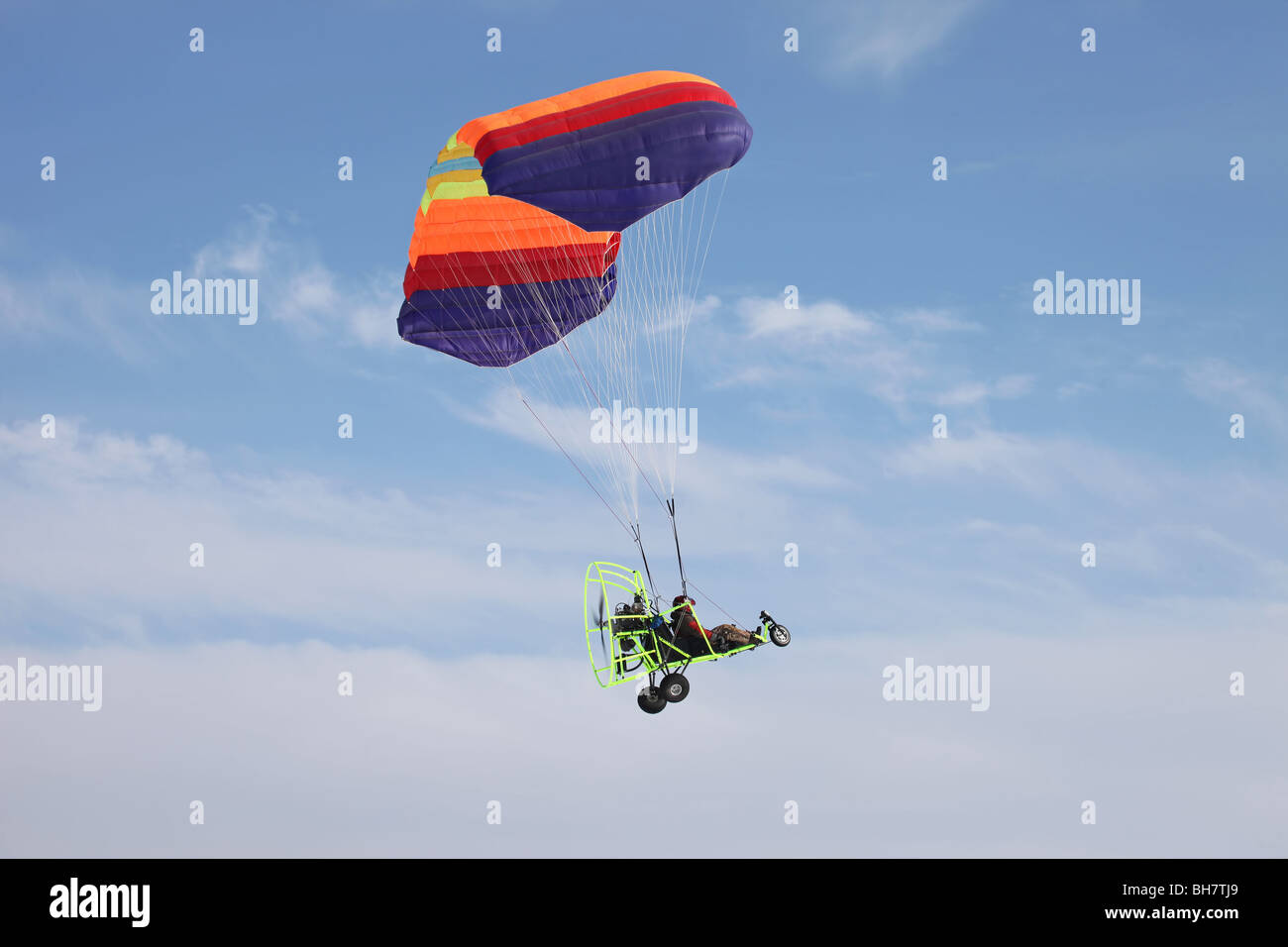 powered parachute flying across