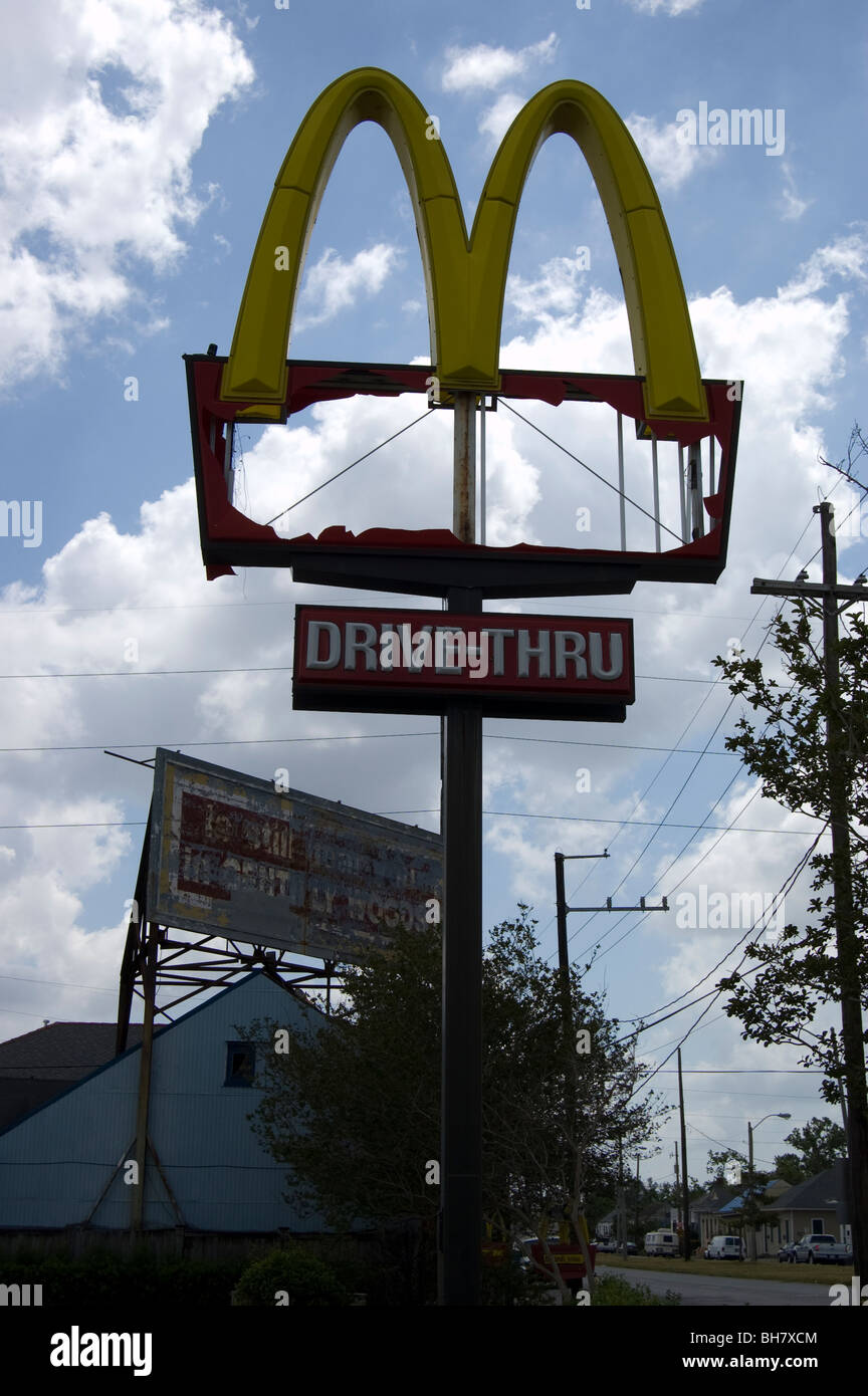 A McDonald's sign partially destroyed by Hurricane Katrina. Stock Photo