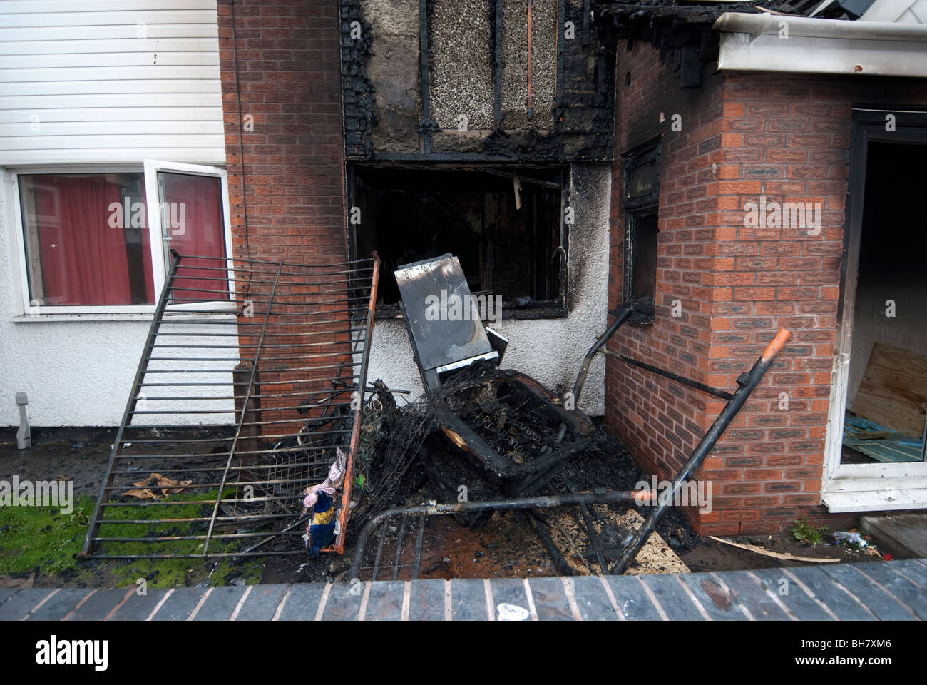 Debris and remains of bed following domestic house bedroom fire Stock