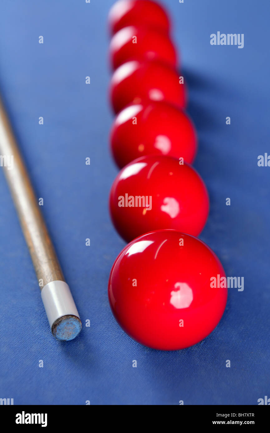 Billiard pool stick with red balls row over blue Stock Photo Alamy