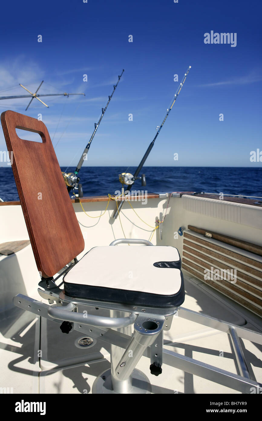 Big game boat wooden fishing chair for tuna wahoo and marlin Stock Photo