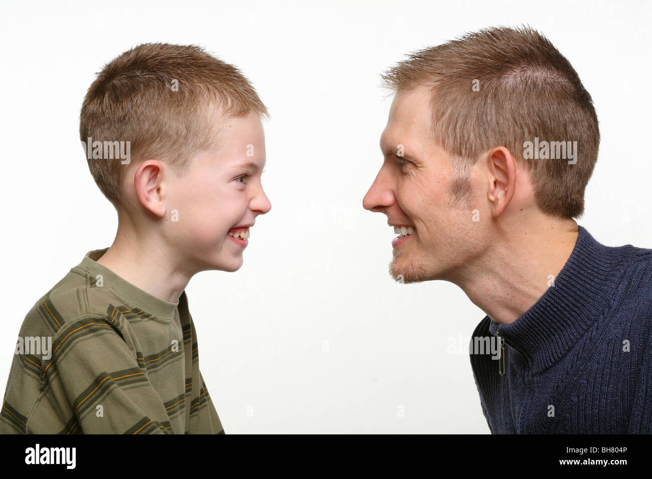 closeup of young father and child with happy faces looking at each other Stock Photo