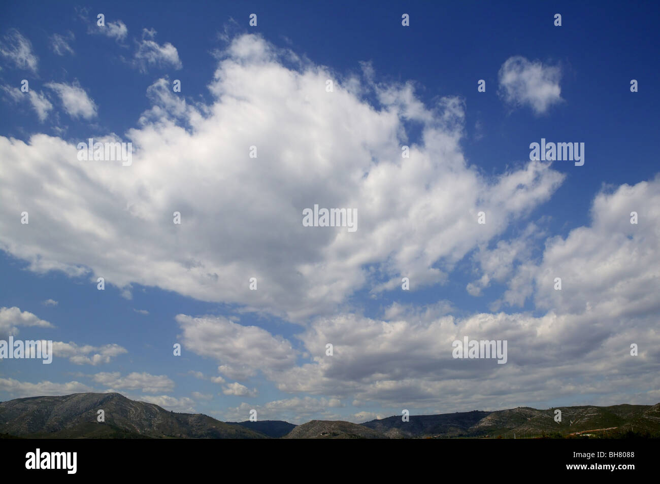 Blue sky white clouds in a summer clean day Stock Photo - Alamy