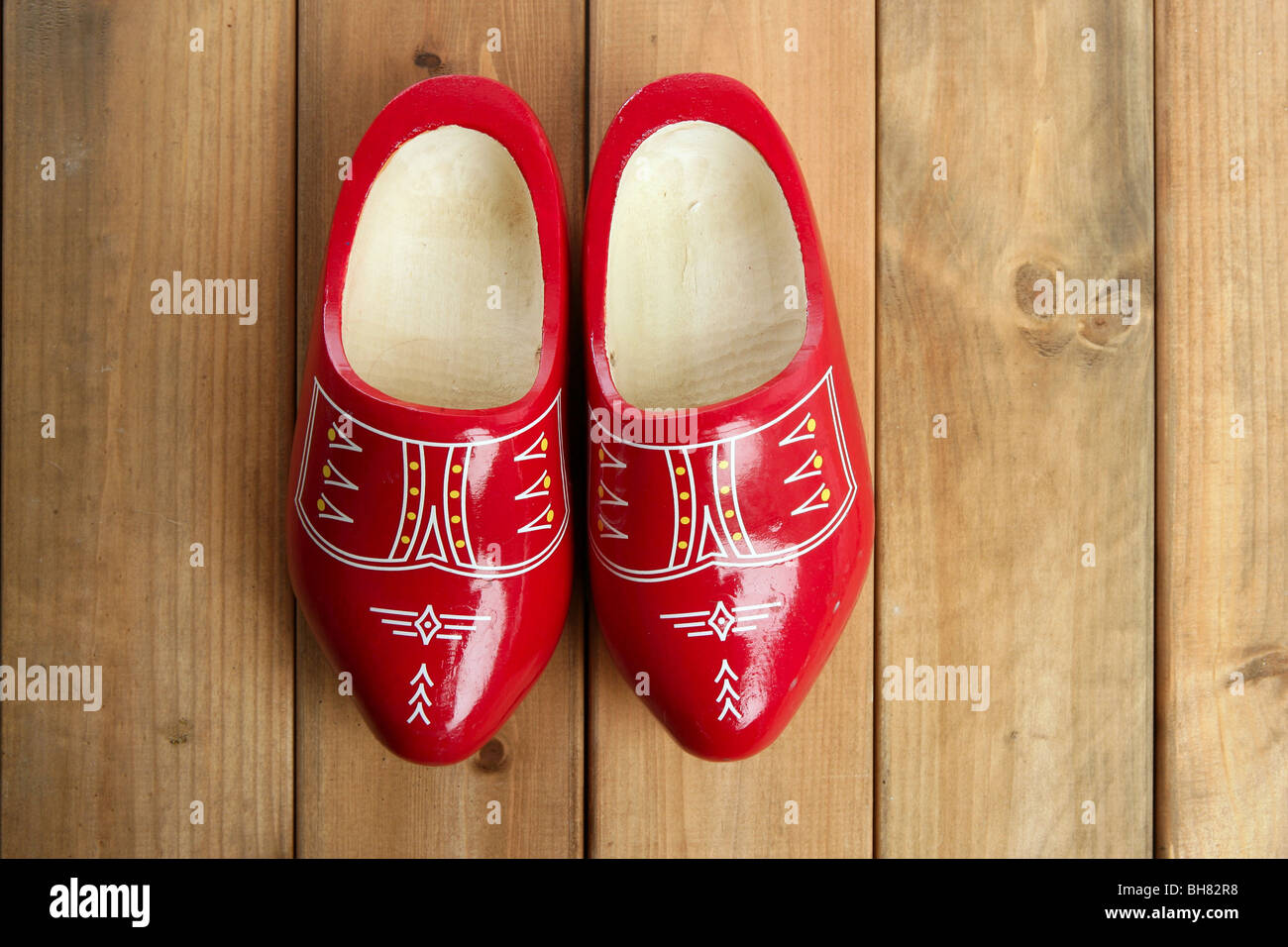 Dutch Holland red wooden shoes on wood background Stock Photo