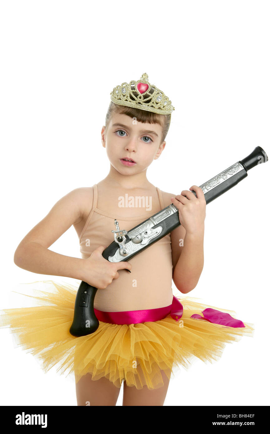 Beautiful little ballerina girl with blunderbuss weapon power and innocence Stock Photo