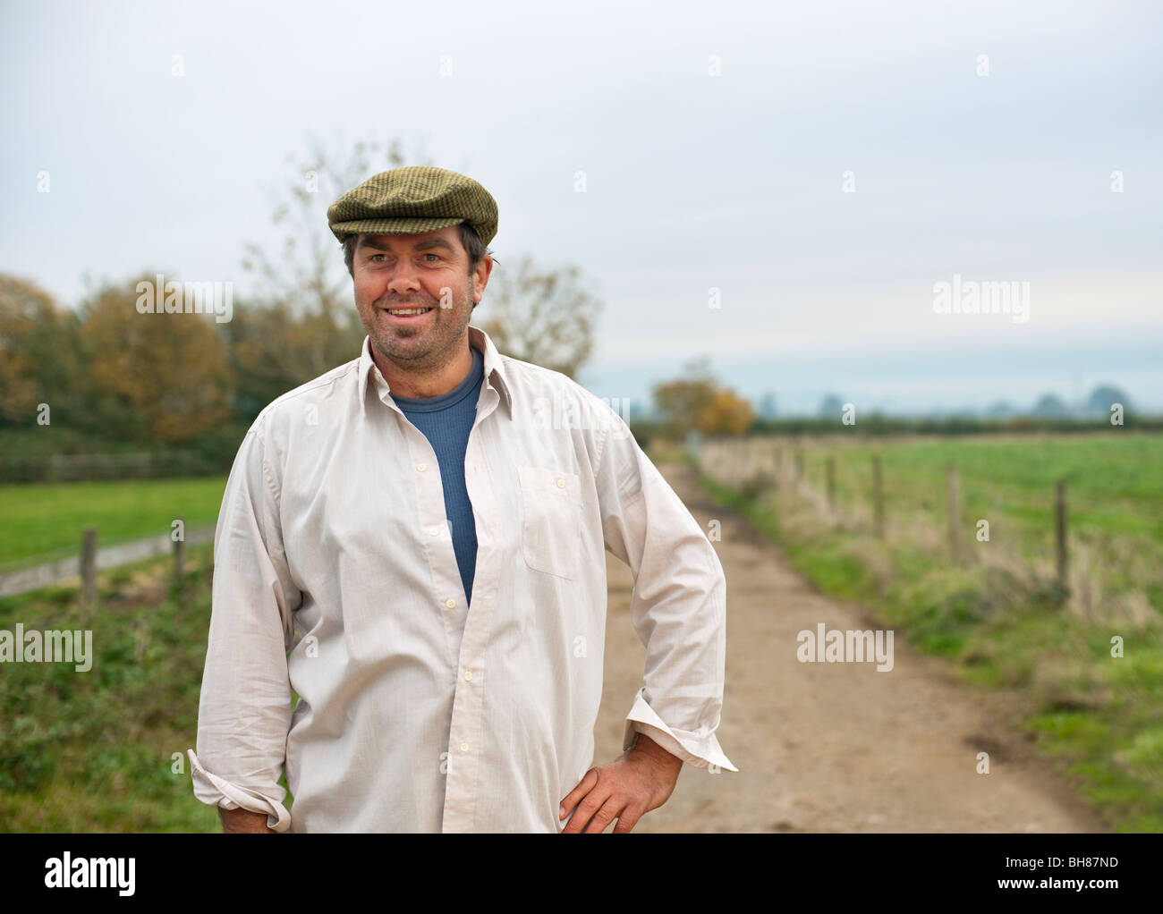 farmer walking in country lane Stock Photo