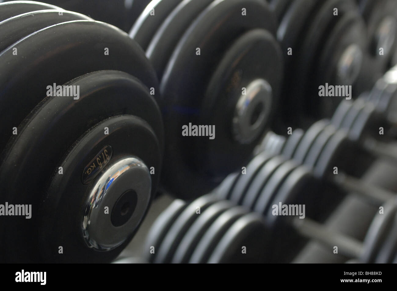 Close up of dumbells on a weight rack Stock Photo