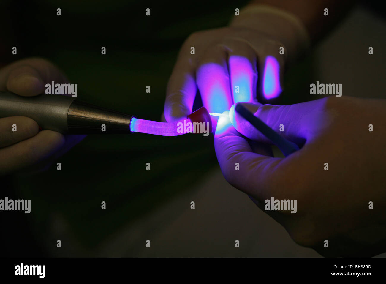 Detail of a dentist using UV light Stock Photo Alamy