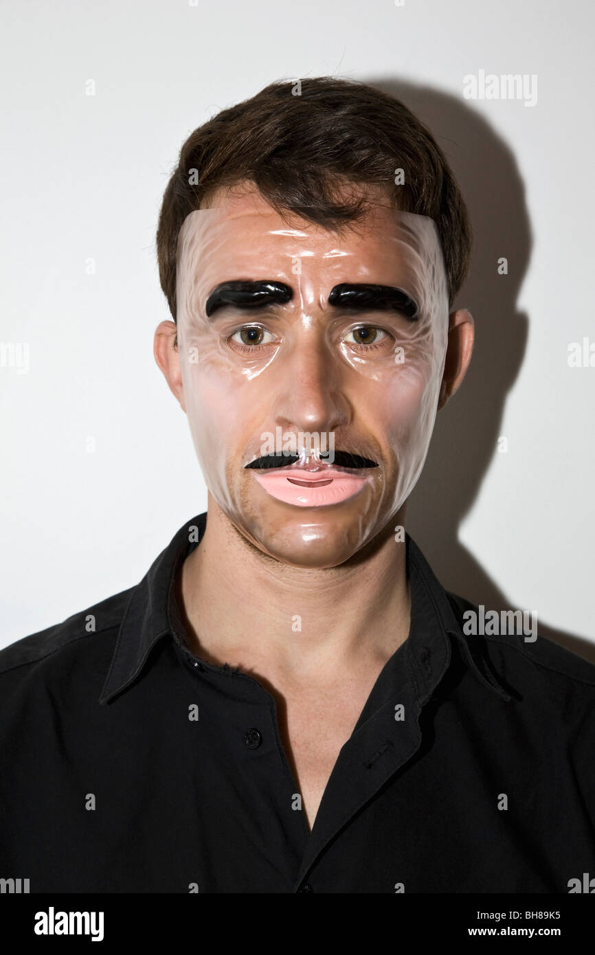 A man wearing a novelty mask Stock Photo Alamy