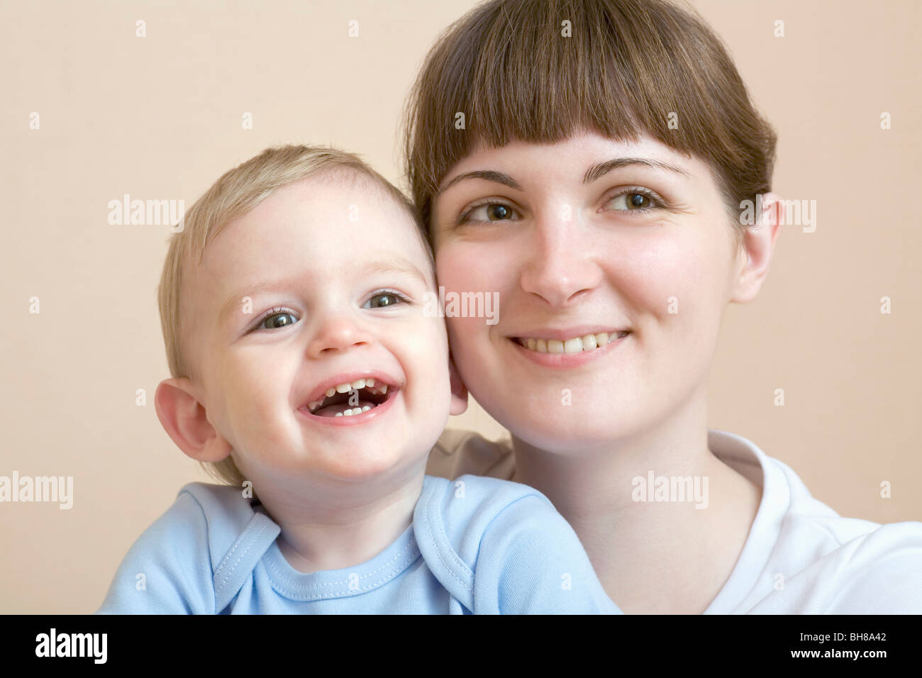 A woman and her baby, portrait, studio shot Stock Photo