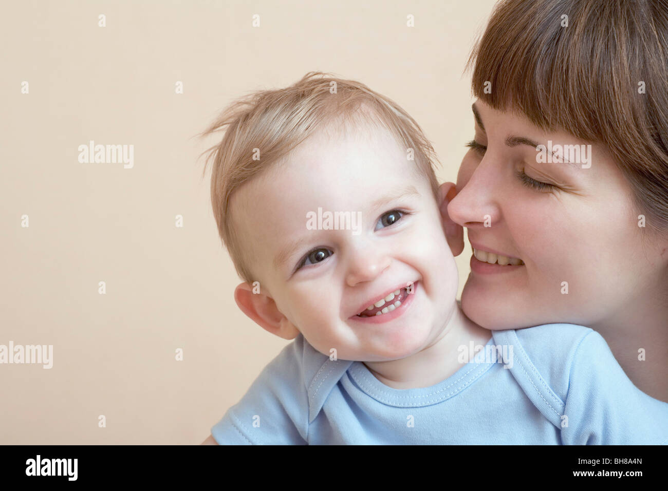 A woman and her baby, portrait, studio shot Stock Photo