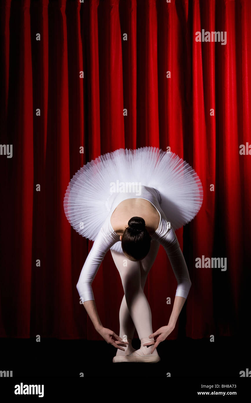 A ballet dancer posing on stage Stock Photo