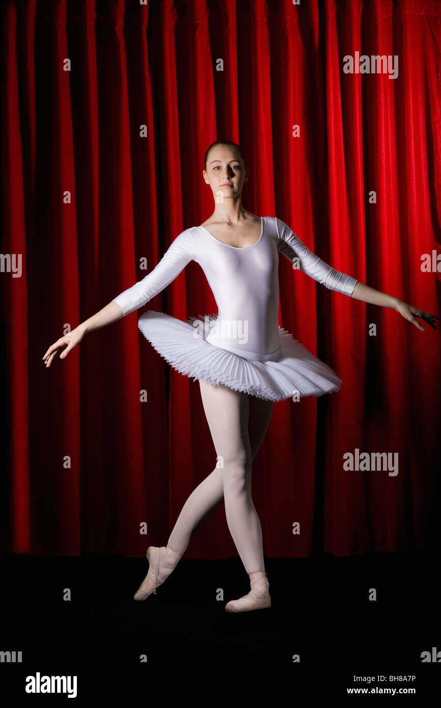 A ballet dancer posing on stage Stock Photo