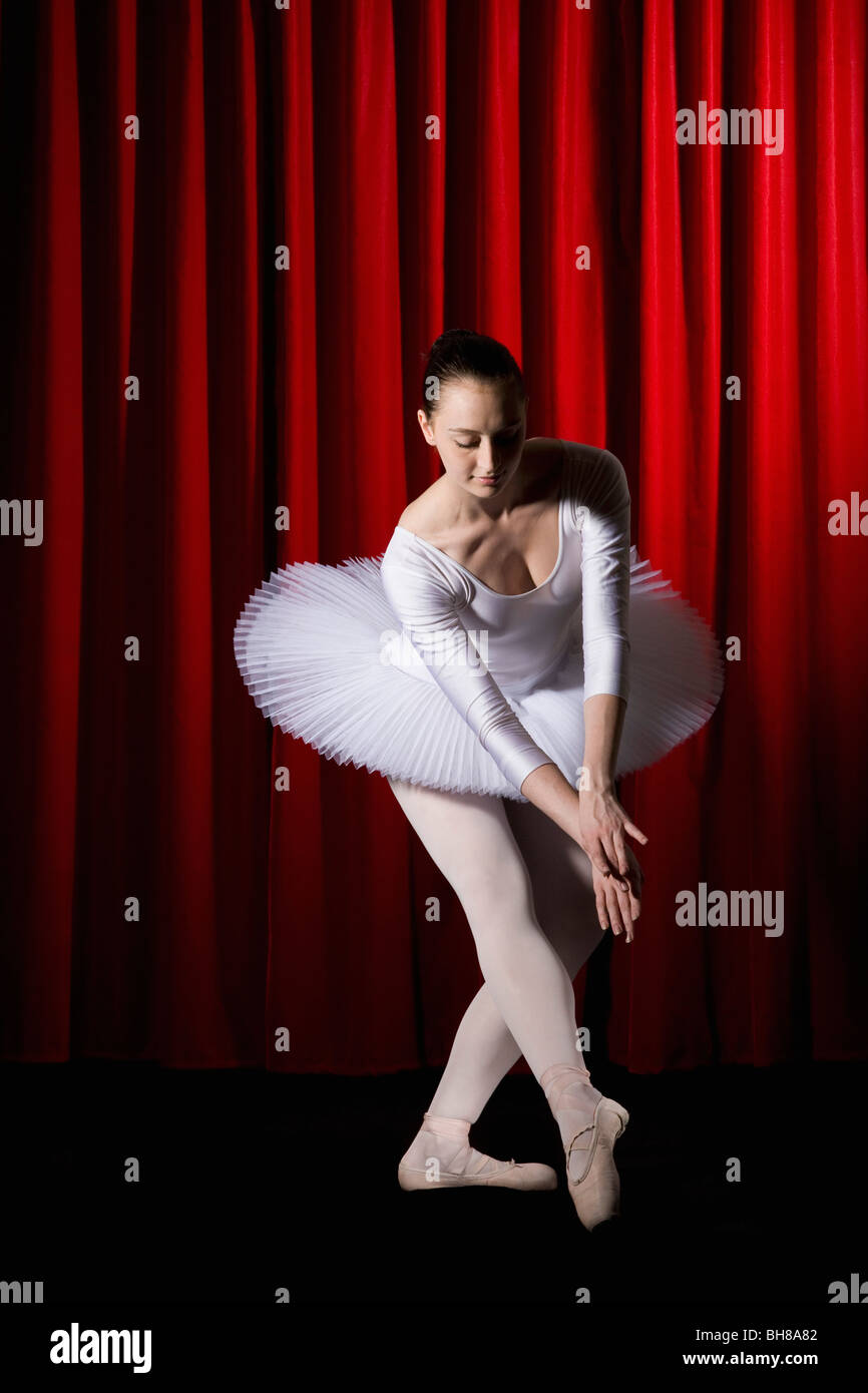 A ballet dancer posing on a stage Stock Photo