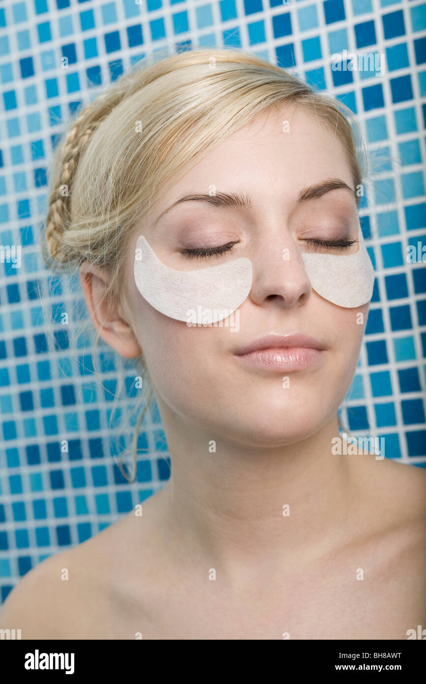 A woman with cotton pads on her cheekbones Stock Photo