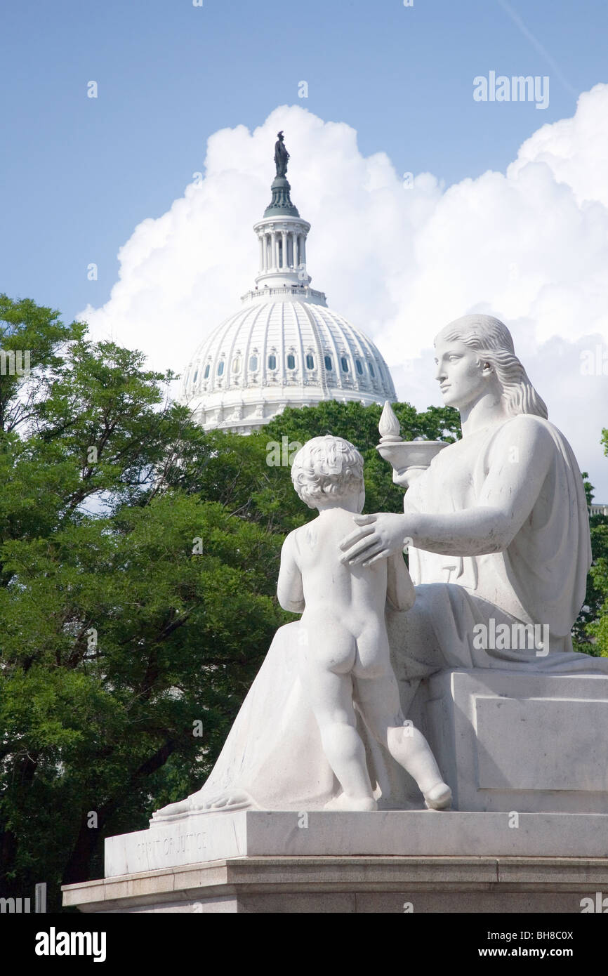 Greek Roman statue in foreground with U.S. Capitol in the background, Washington, D.C. Stock Photo