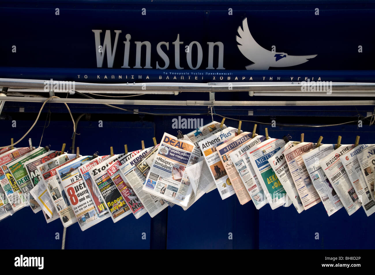 Newspapers on sale Railway Station Piraeus Athens Greece Stock Photo