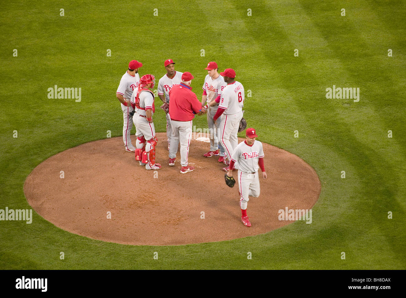 Philadelphia Phillies coach, pitcher and infielders meeting on mound during National League Championship Series (NLCS) Stock Photo