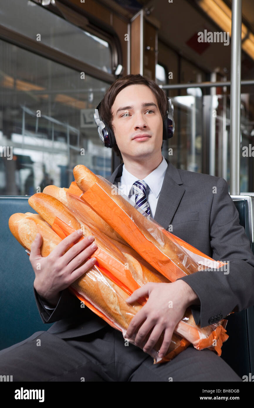 businessman in tube with lot of bread Stock Photo
