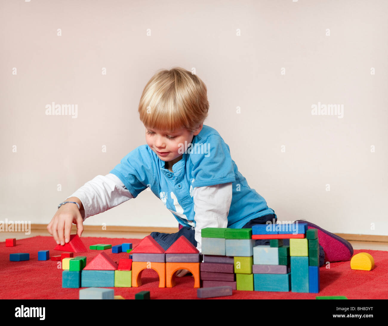 boy with toy building blocks Stock Photo