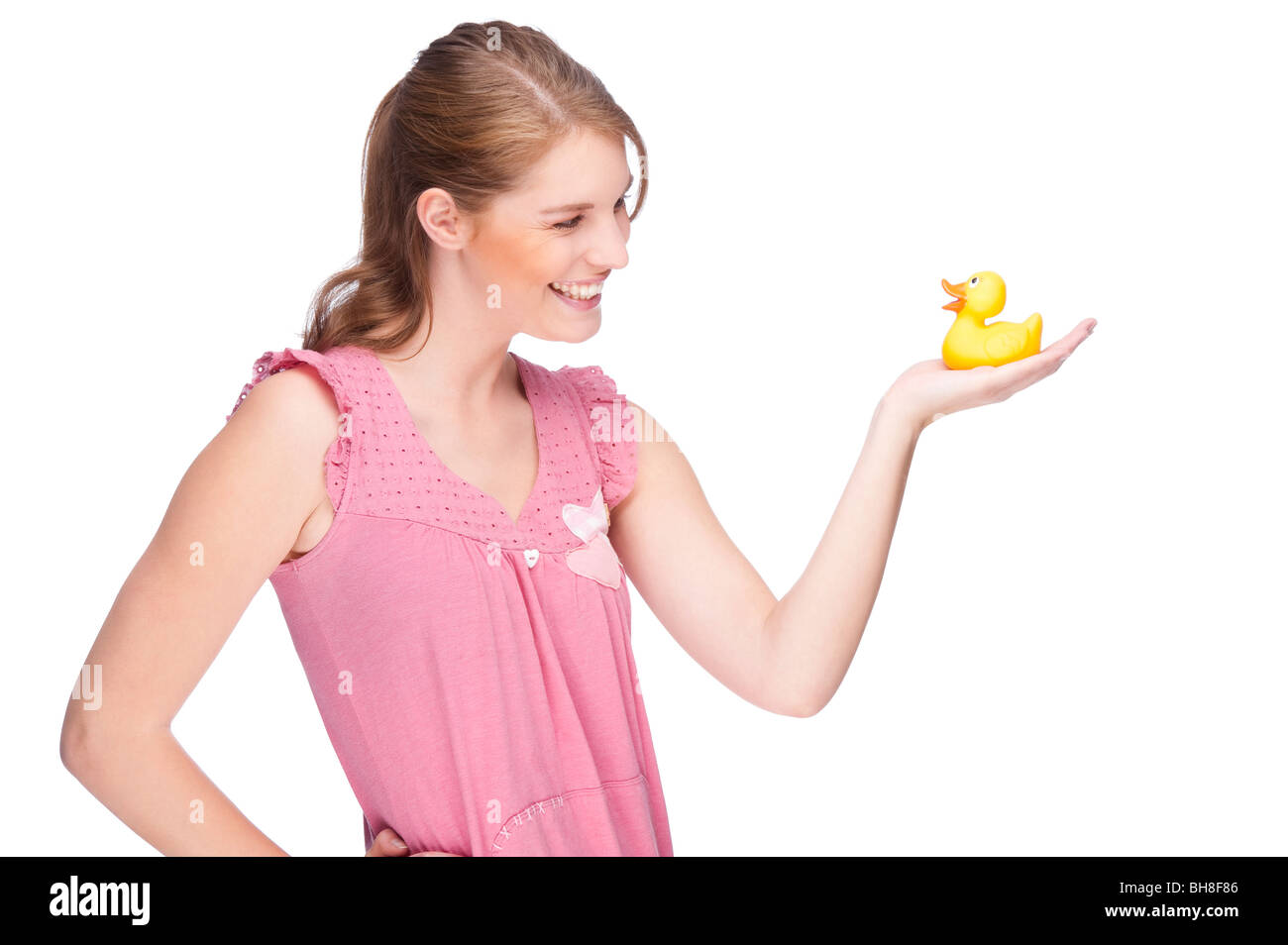 Full isolated studio picture from a young woman with yellow rubber duck Stock Photo
