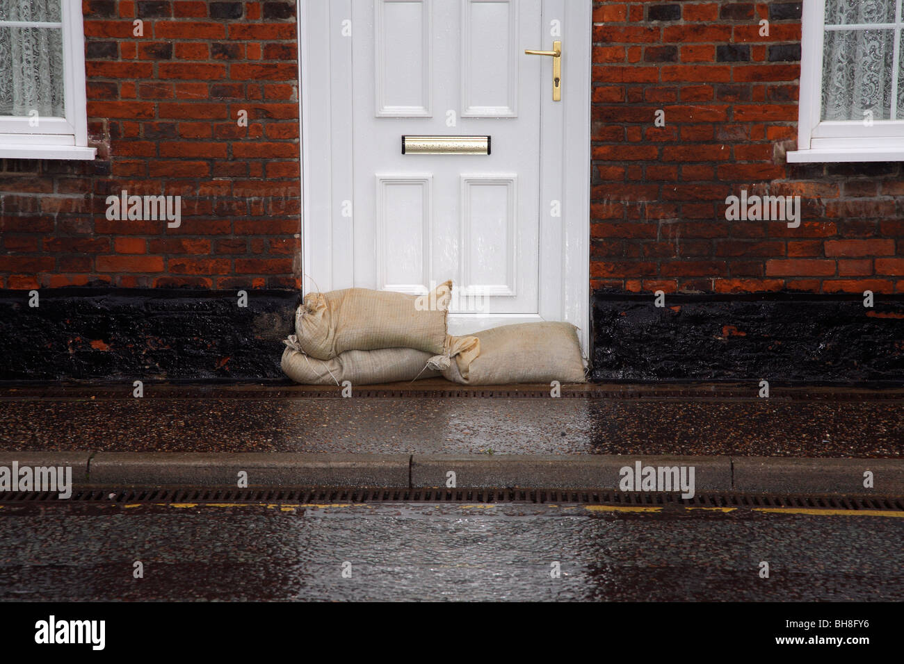 Residents prepare for flooding with sandbags. Stock Photo