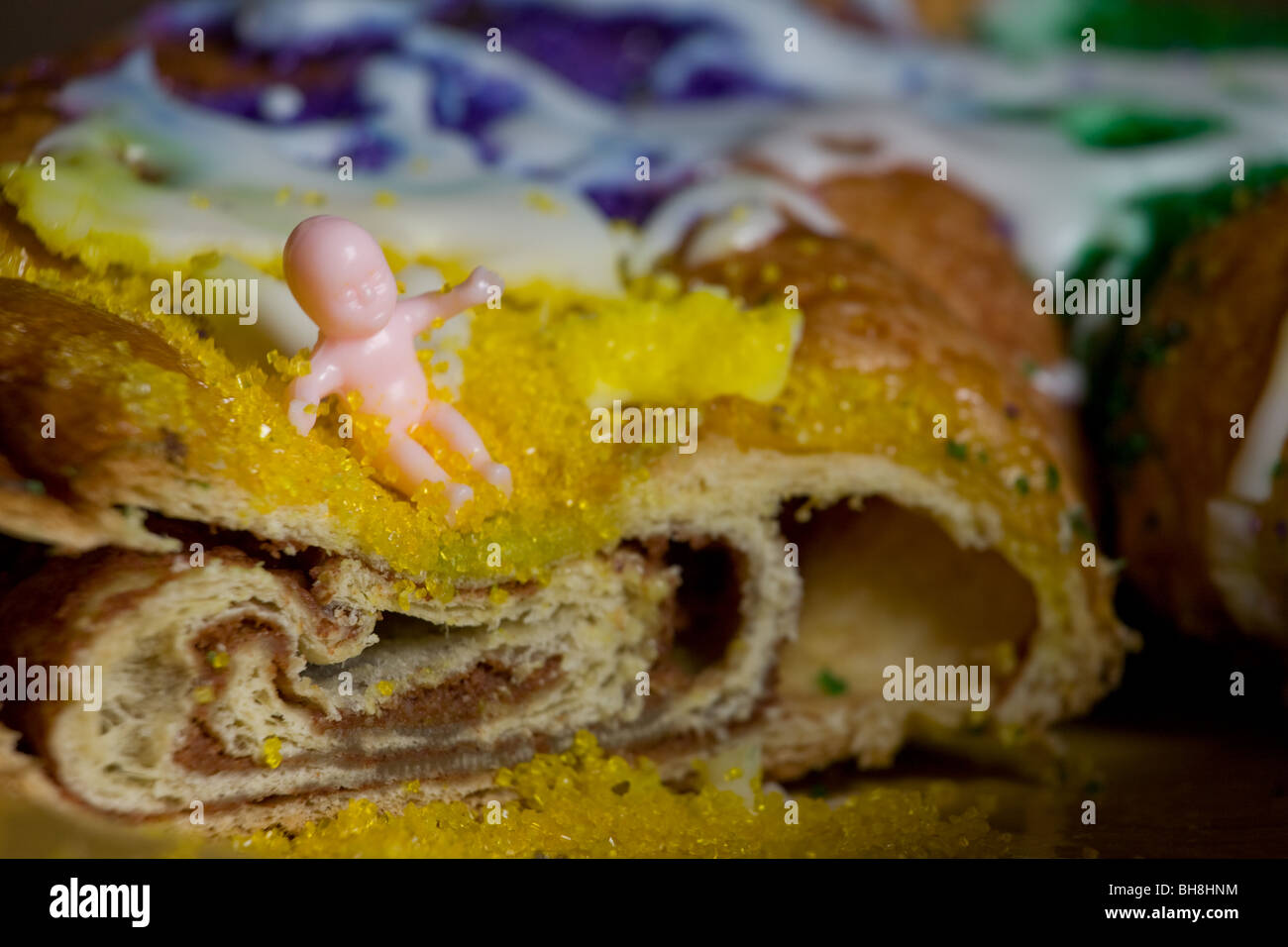 Mardi gras tradition, King cake contains a plastic baby toy which brings good luck. New Orleans, Louisiana Stock Photo