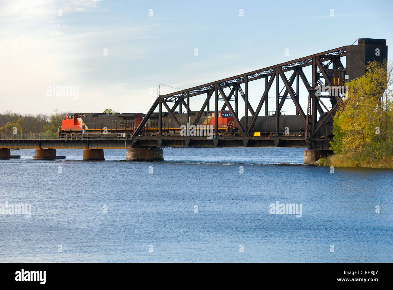 Train crossing the Ranier lift bridge, the oldest cantilevered bridge in North America, Ranier, Minnesota Stock Photo
