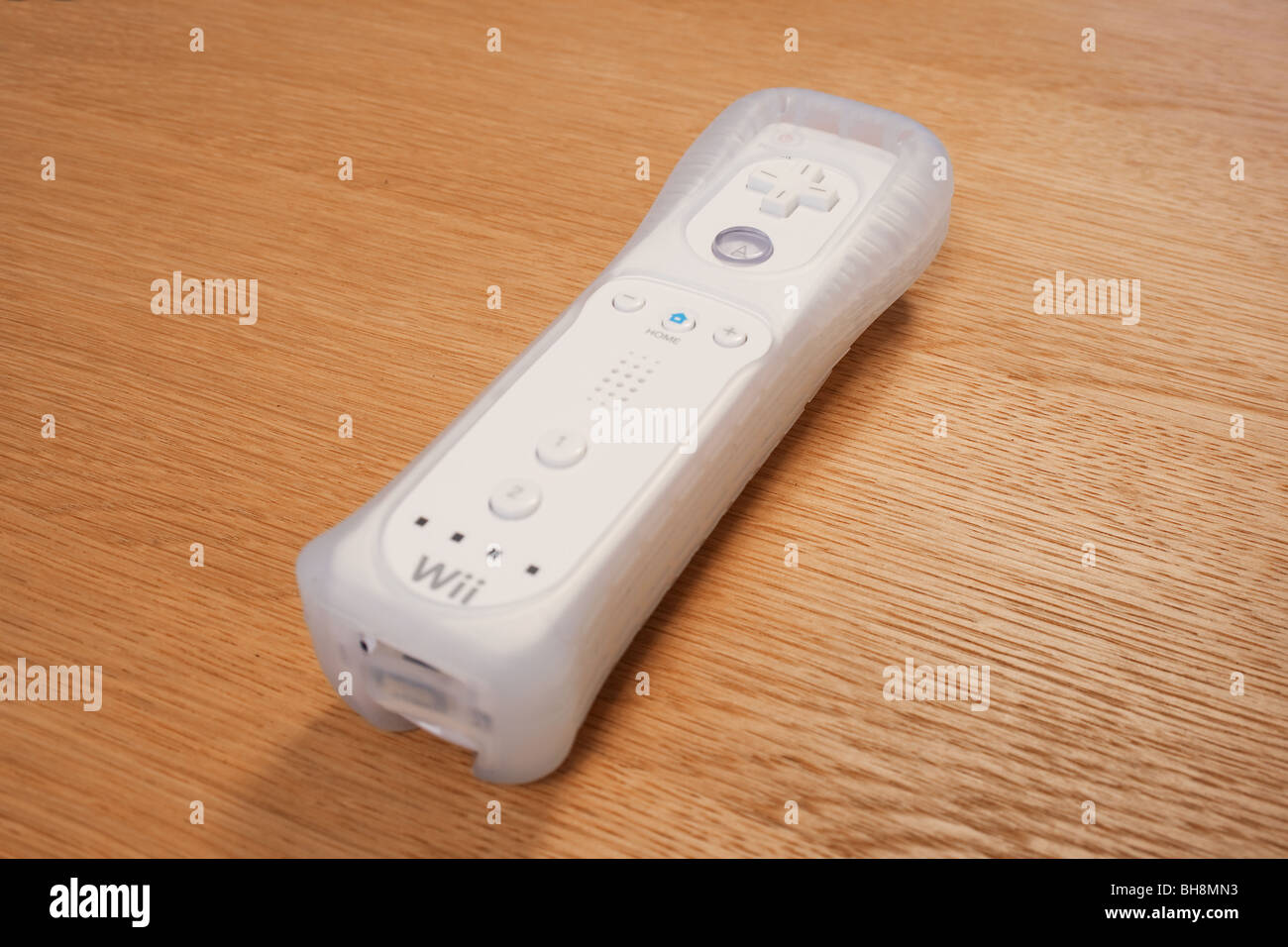 Nintendo Wii handset in rubber protector on wood surface Stock Photo - Alamy