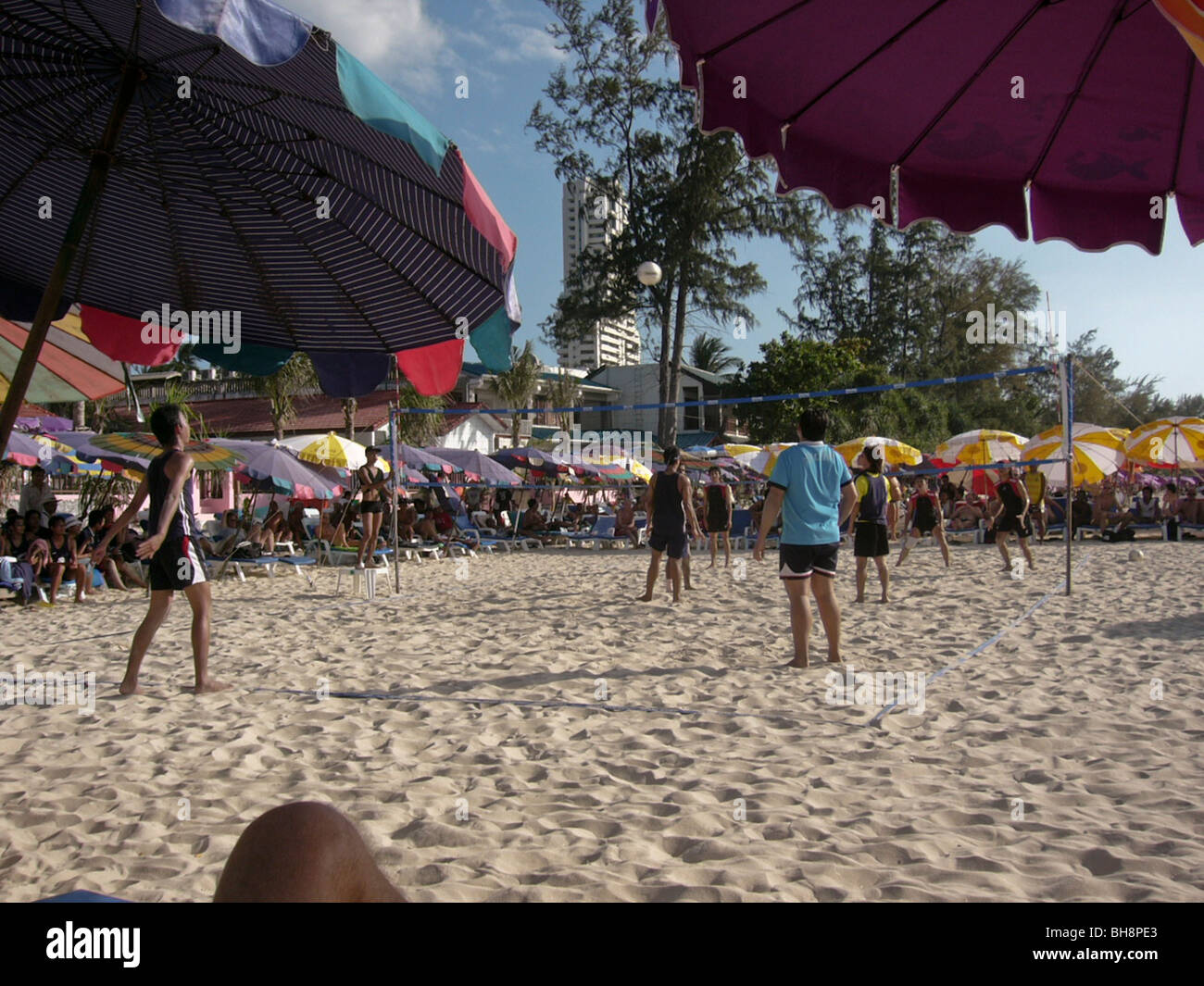 Thailand Islands, Group of Teenagers Playing Beach Volleyball Stock