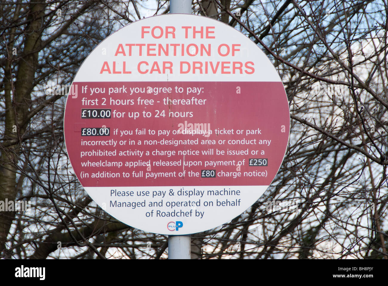 Sign showing parking fees at Rownhams motorway service station car park