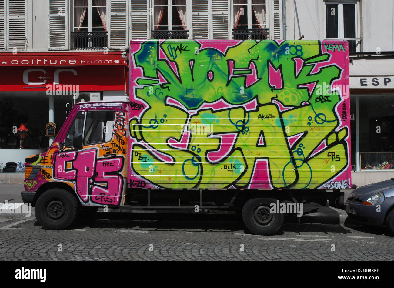 Graffiti covered van in Paris Stock Photo