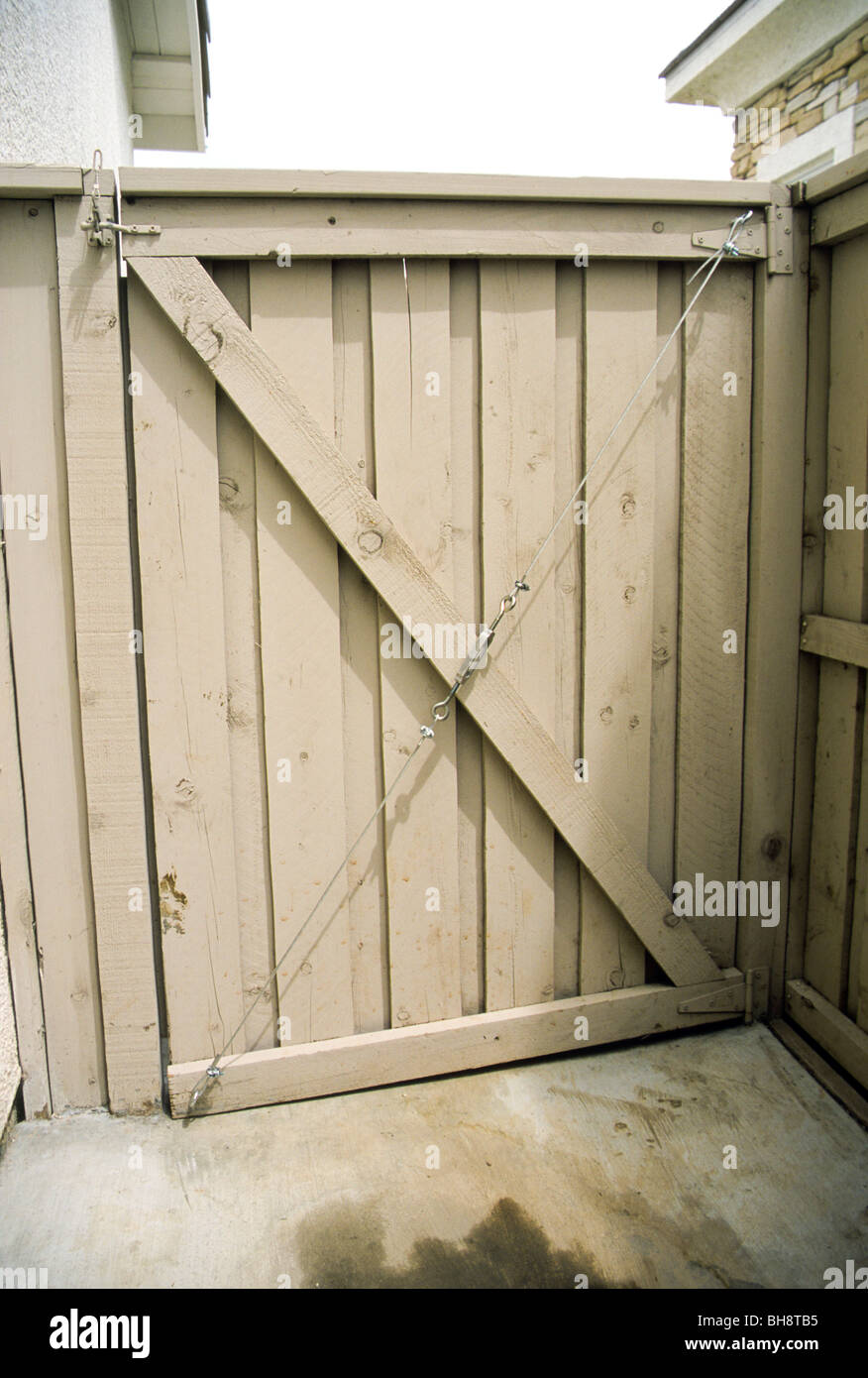 gate door closure diagonal support cable Stock Photo