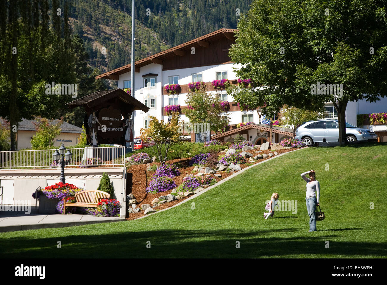 Mother and child playing in park in the centre of Leavenworth, a Bavarian styled town in Chelan County, Washington, USA Stock Photo