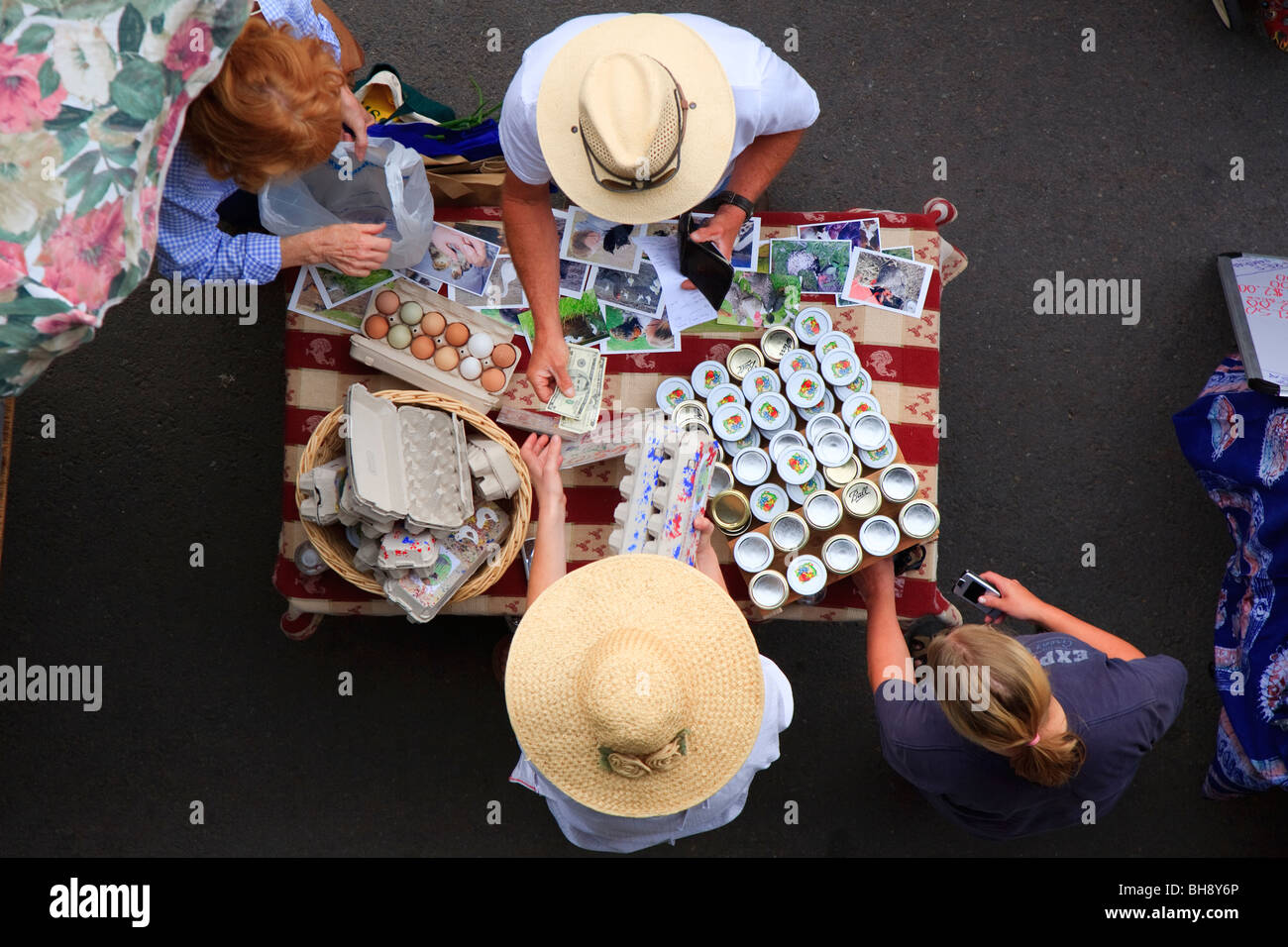 Looking down on customers paying for eggs at Clark Fork River Market, Missoula Montana, USA Stock Photo
