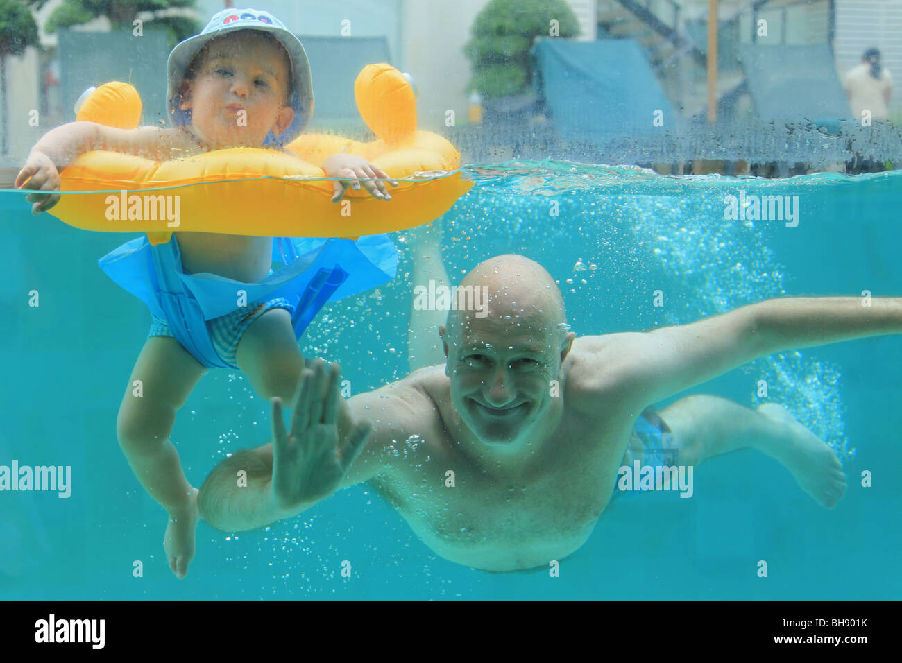 Father son swimming underwater in hi-res stock photography and images