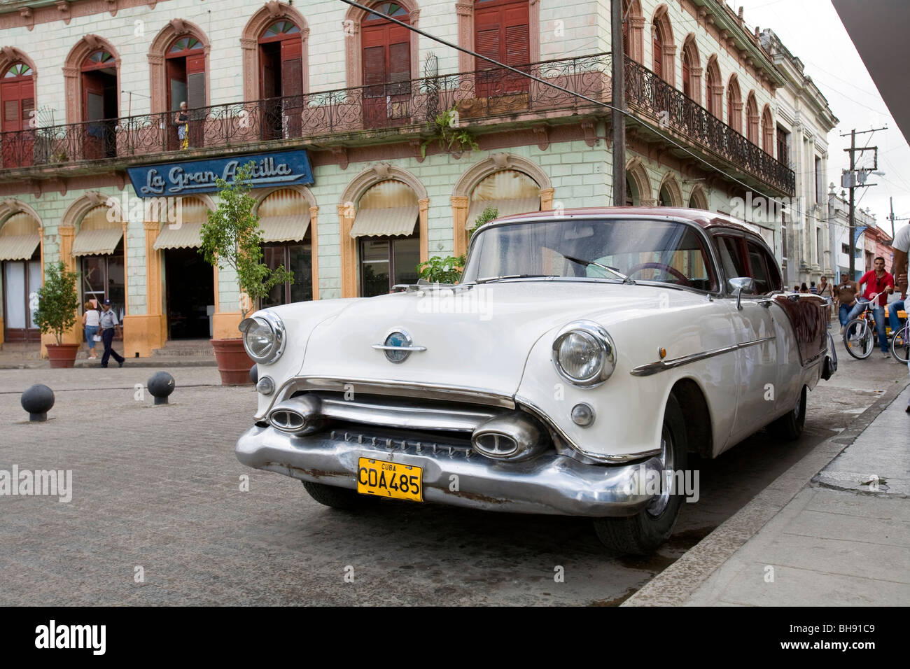 Street Scene with old Limousine, Camagueey, Caribbean Sea, Cuba Stock Photo