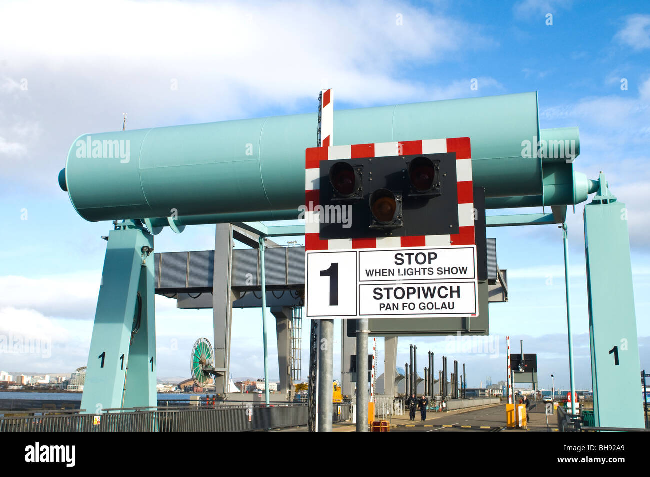 Bascule Bridge on the Cardiff Bay Barrage in South Wales with stop sign and warning lights Stock Photo