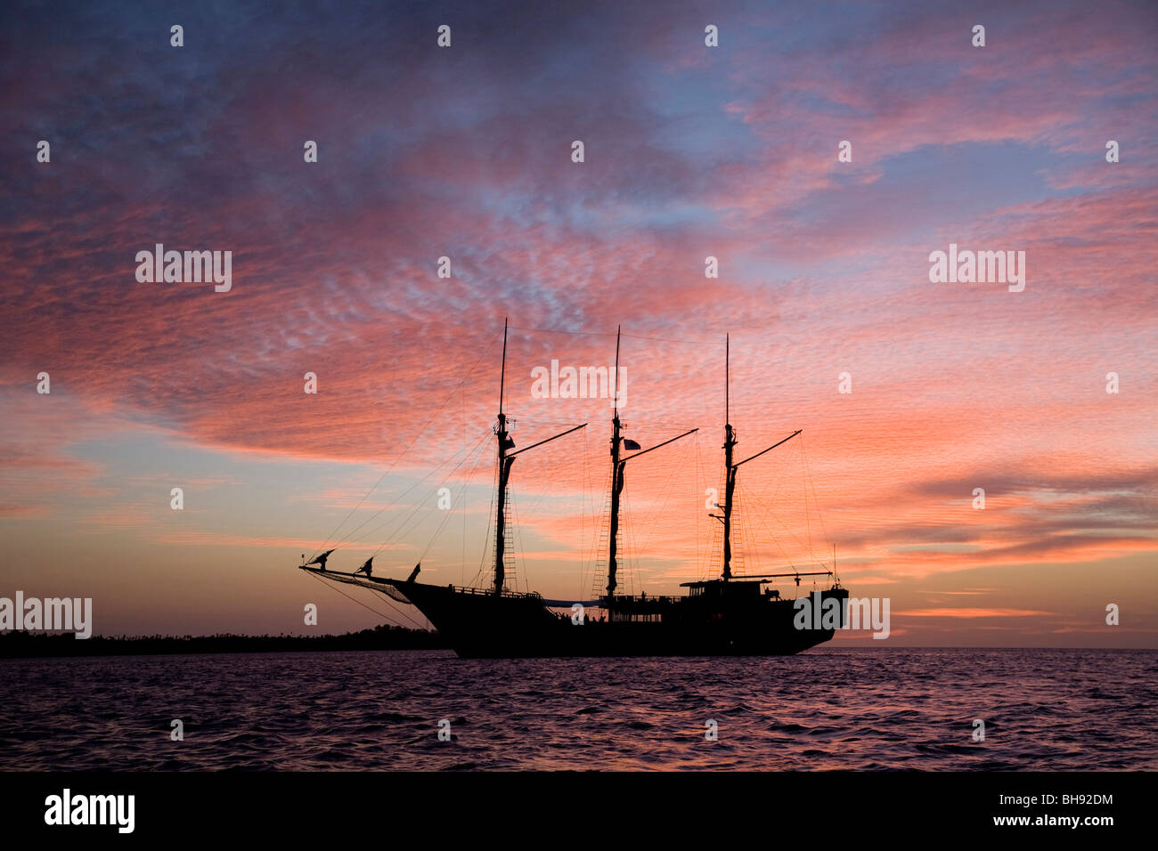 Sailing into Sunset, Sangihe-Talaud Archipelago, Sulawesi, Indonesia Stock Photo
